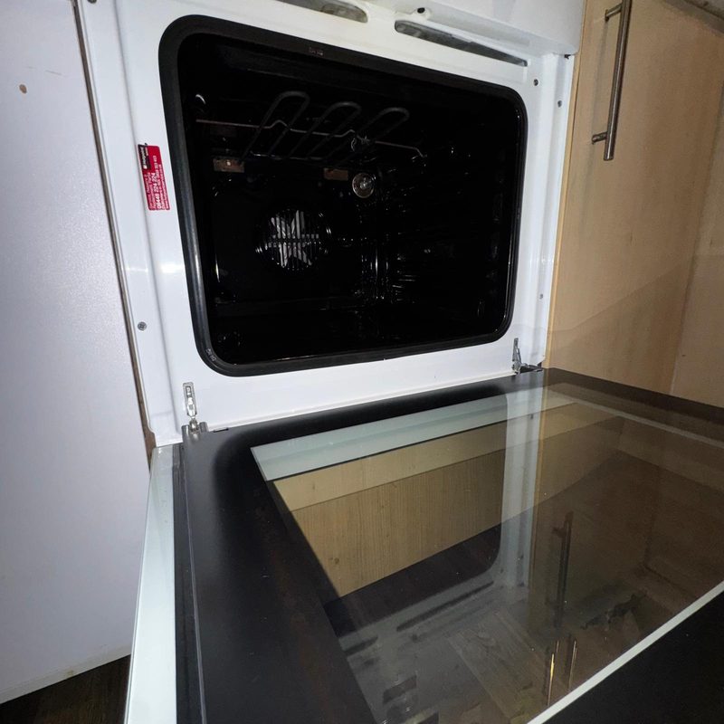 An oven door and glass after cleaning